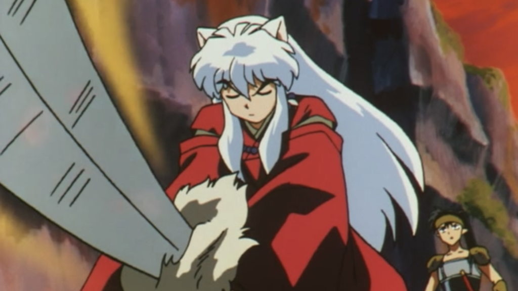 Inuyasha draws Tetsusaiga to smash a barrier